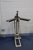 AN UNBRANDED PICTURE FRAMERS JOINTER ON STAND bed height 120cm