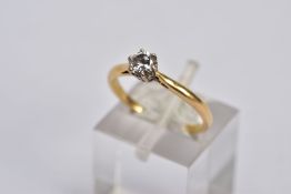 A YELLOW METAL SINGLE STONE DIAMOND RING, designed with a claw set, round brilliant cut diamond,