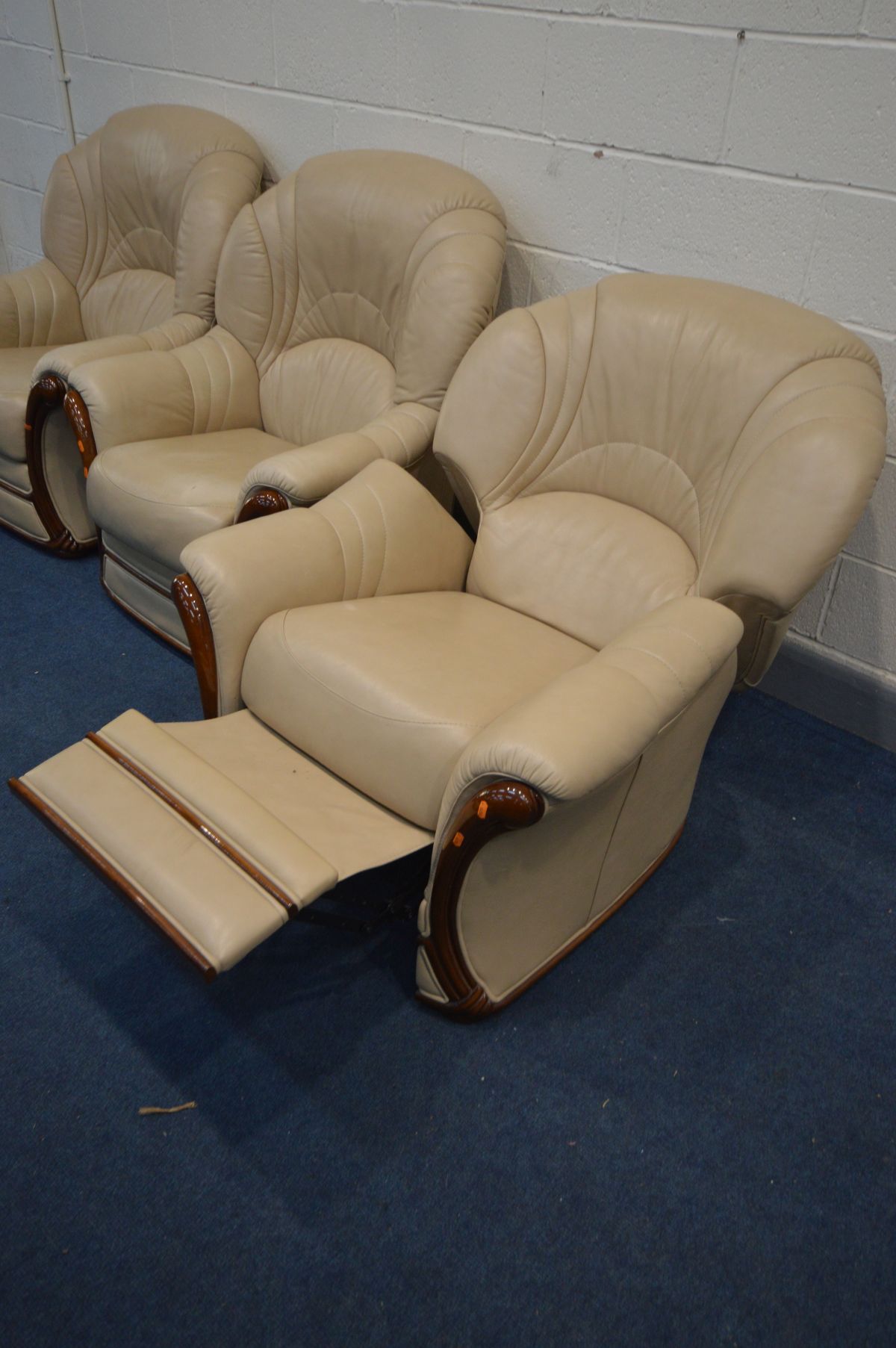 A RECLINING BIEGE LEATHER AND WOOD FRAMED MANUAL RECLINING ARM CHAIRS, and two matching armchairs ( - Image 2 of 2