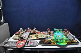 A BOX CONTAINING EIGHT DISTRESSED VINTAGE SKATEBOARDS including United Skates, Decathalon, Variflex,