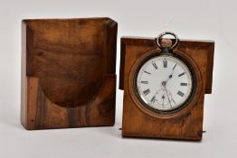 A WOODEN POCKET WATCH STAND WITH AN OPEN FACE POCKET WATCH, olive wood stand, opens to reveal an