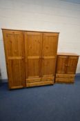 A PINE THREE DOOR WARDROBE, with two drawers, width 157cm x depth 54cm x height 183cm and a tallboy,