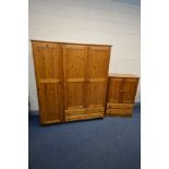 A PINE THREE DOOR WARDROBE, with two drawers, width 157cm x depth 54cm x height 183cm and a tallboy,