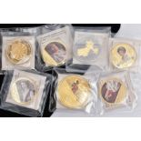 A SEVEN GROUP OF GOLD LAYERED MAINLY ROYALTY THEMED AND COLOURED COIN/MEDALS to include a Liberty