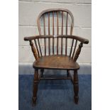 A PERIOD ELM CHILDS HOOP BACK WINDSOR ARM CHAIR (repair to back right leg, doesn't sit well on level