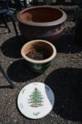 A BROWN CIRCULAR GARDEN PLANTER, diameter 51cm x height 37cm, along with a smaller green glazed