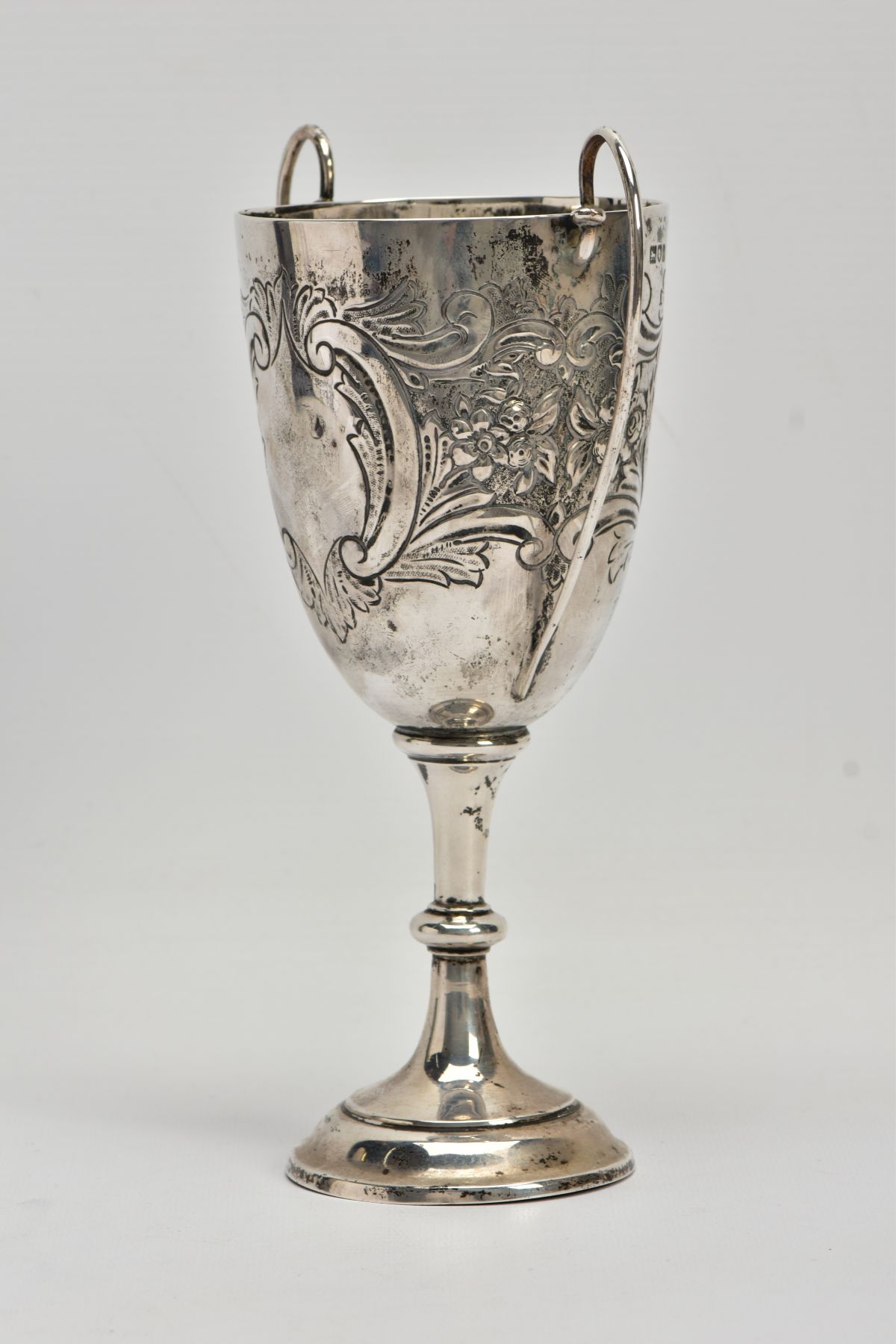 A SILVER TROPHY CUP, double scroll handles, embossed floral and foliate design, with a vacant - Image 2 of 7