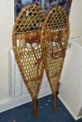 A PAIR OF LATE 20TH CENTURY BENTWOOD AND GUT STRUNG SNOWSHOES, with tan leather straps, length