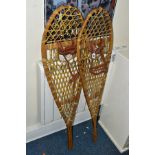 A PAIR OF LATE 20TH CENTURY BENTWOOD AND GUT STRUNG SNOWSHOES, with tan leather straps, length