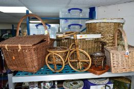 A SMALL GROUP OF WICKER ITEMS, to include a wicker basket, a four section basket (bottle carrier),