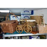 A SMALL GROUP OF WICKER ITEMS, to include a wicker basket, a four section basket (bottle carrier),