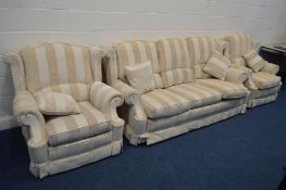 A GOLD AND CREAM STRIPPED THREE PIECE LOUNGE SUITE, comprising a settee, width 210cm, and a pair