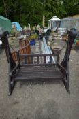 A STAINED TEAK SWING SEAT, bench length 122cm x frame length 154cm (paint partially peeling)