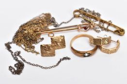 A SELECTION OF JEWELLERY, to include a yellow metal bar brooch set with a circular cut garnet within