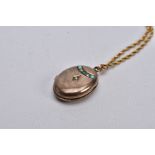 A VICTORIAN YELLOW METAL SPLIT PEARL AND TURQUISE LOCKET NECKLACE, the AF locket of an oval form,