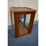 AN EARLY TO MID OAK JEWELLERY DISPLAY CABINET, with bevelled glass panels, mirror back and a