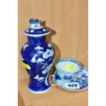 A NANKING CARGO CHINESE PORCELAIN TEA BOWL AND SAUCER, blue and white decoration of a pagoda in a