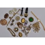 A BAG OF ASSORTED COSTUME JEWELLERY, to include a silver charm bracelet suspending seven charms in