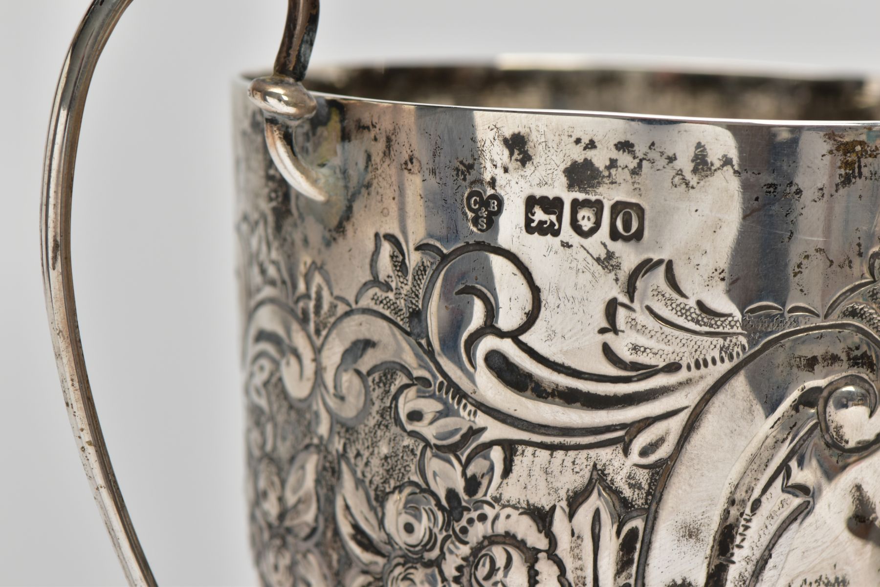 A SILVER TROPHY CUP, double scroll handles, embossed floral and foliate design, with a vacant - Image 5 of 7