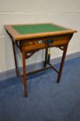 AN ARTS AND CRAFTS OAK WRITING/CARD TABLE, with a green baize inlay, single frieze drawer with art