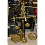 A SET OF PORTUGESE STYLE TWIN BEAM BALANCE SCALES, brass construction with bulls head capitol, two