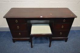 A STAG MINSTREL DRESSING TABLE, with a triple mirror and six assorted drawers, width 136cm x depth