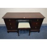 A STAG MINSTREL DRESSING TABLE, with a triple mirror and six assorted drawers, width 136cm x depth