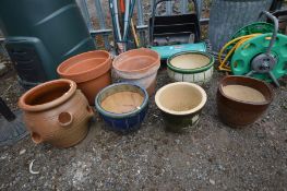 A GLAZED HERB POT, along with two terracotta plant pots, and four glazed plant pots (7)