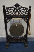 AN ORIENTAL KASHMIRI HARDWOOD DINNER GONG, with open fretwork depicting vines and leaves, along with