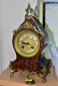 A FRENCH BOULE STYLE MANTLE CLOCK, with gilt metal mounts, the gilt dial with enamel Roman numerals,