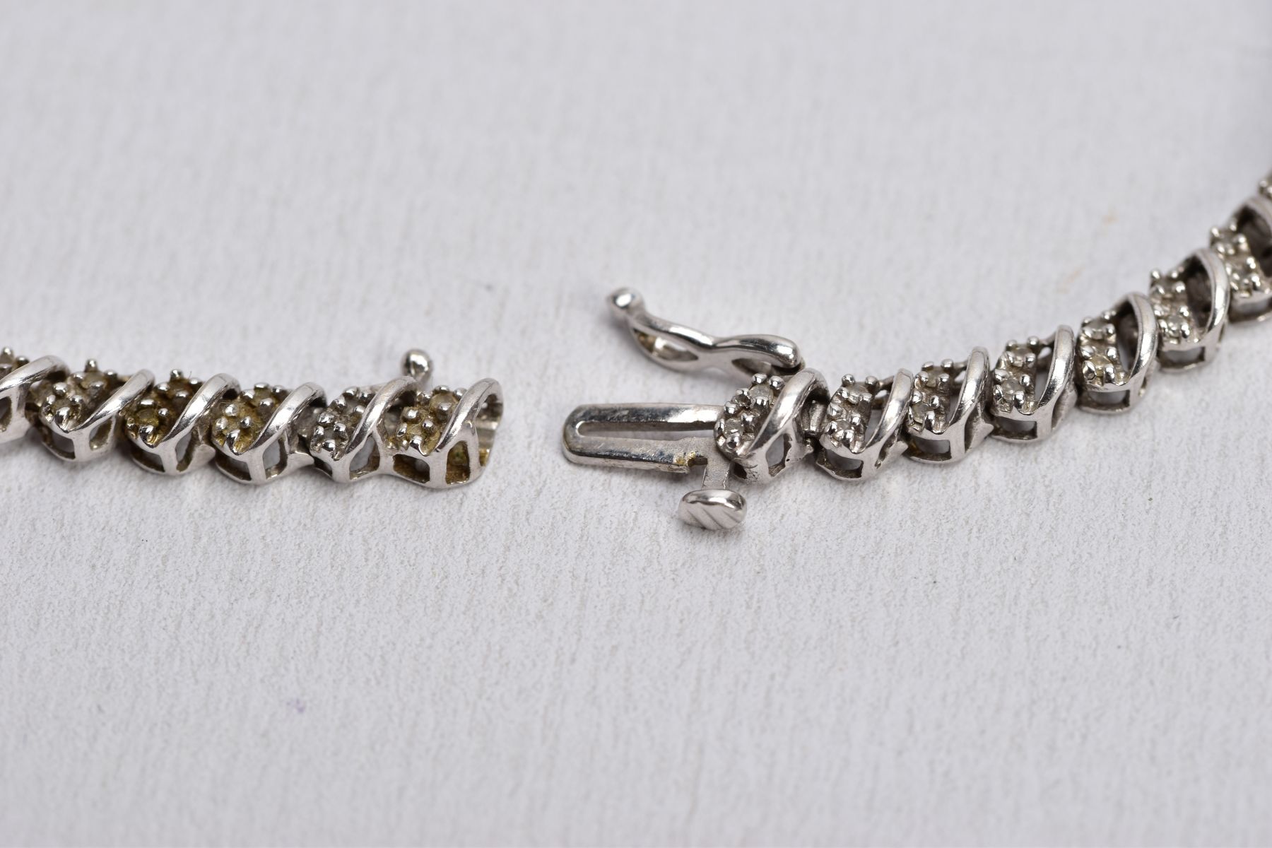 A WHITE METAL DIAMOND LINE BRACELET, openwork single cut diamond detailed links, fitted with a - Image 3 of 3