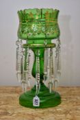A LATE VICTORIAN GREEN GLASS LUSTRE, gilt foliate and white enamel decoration, with two tiers of