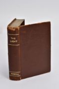 A DUNHILL NOVELTY TABLE LIGHTER, 'THE LIGHT', in the form of a book, brown leather bound with a gilt