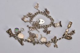 TWO CHARM BRACELETS, the first suspending eight white metal charms in forms such as a bible, church,