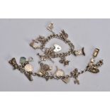 TWO CHARM BRACELETS, the first suspending eight white metal charms in forms such as a bible, church,