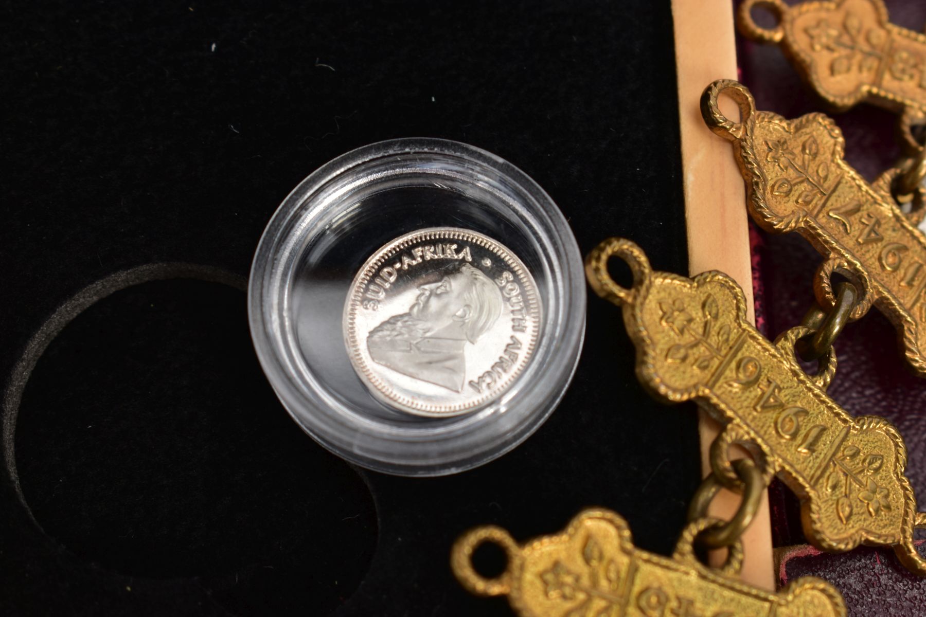 A SMALL PACKET OF ITEMS to include a boxed 20th/ounce silver Krugerrand, a 12 year St Johns - Image 3 of 4