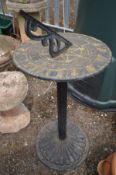 A BLACK METAL SUN DIAL on a circular stand, height 64cm