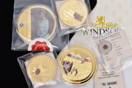 A GROUP OF GOLD PLATED COINS to include 110g Diana coin, a 110g V E Day coin, a Rule Britannia 54g