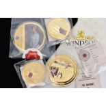 A GROUP OF GOLD PLATED COINS to include 110g Diana coin, a 110g V E Day coin, a Rule Britannia 54g