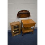 A PINE GLAZED SINGLE HANGING CABINET, an oak tea trolley and a hanging oak shelf with a carved