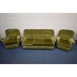 A 1960S GREEN UPHOLSTERED FOUR PIECE LOUNGE SUITE, teak outswept armrests, comprising a settee,