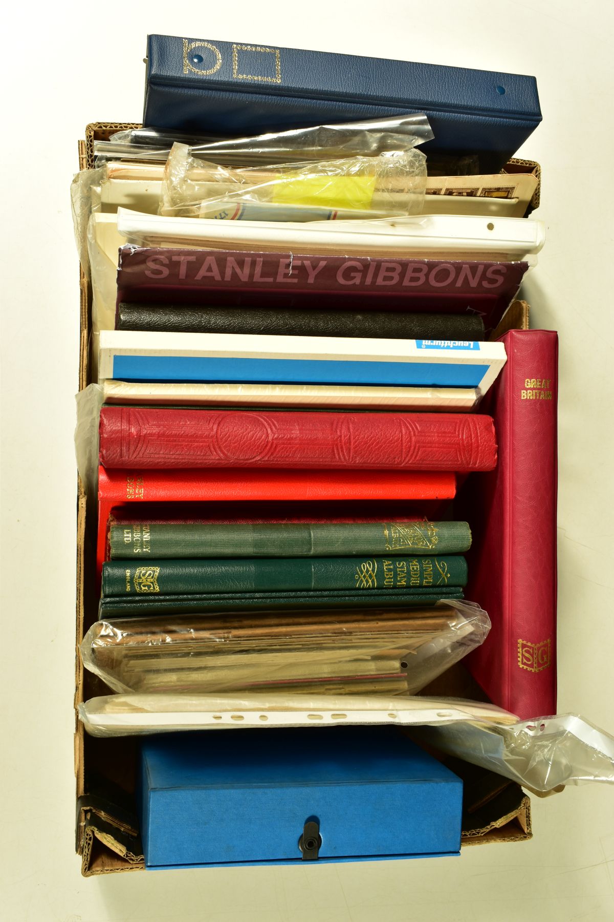 A LARGE BOX OF STAMPS AND ACCESSORIES including some early USA types in mixed condition empty albums