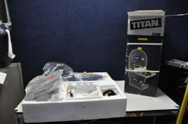 A BRAND NEW IN BOX TITAN SF8R BANDSAW ( doesn't appear to have been put together no PAT required