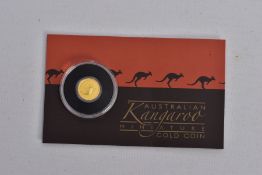 AN AUSTRALIAN KANGAROO MINIATURE GOLD COIN, unopened in original packaging, 0.5 gram 9999 gold,