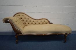 A VICTORIAN WALNUT CHAISE LONGUE, with buttoned upholstery, on scrolled legs, length 194cm (