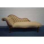 A VICTORIAN WALNUT CHAISE LONGUE, with buttoned upholstery, on scrolled legs, length 194cm (