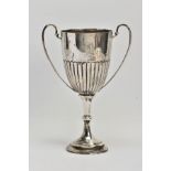 A SILVER TROPHY CUP, double scroll handles, stop reeding design to half of the cup, tapered stem, on