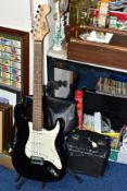 A CHINESE MADE SQUIER STRAT BY FENDER ELECTRIC GUITAR, CAE-0050360858, with a soft carry case (