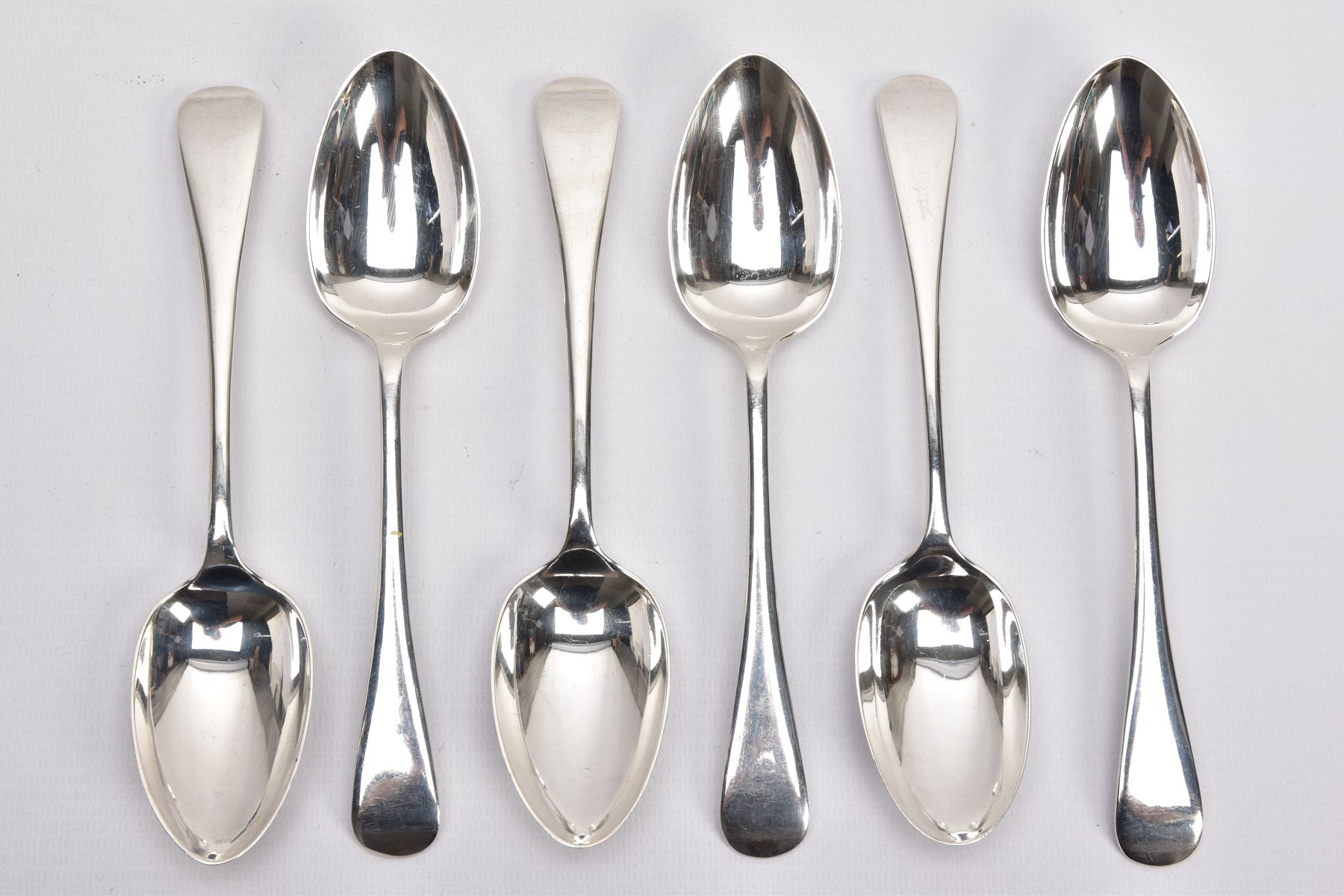 SIX SILVER TABLESPOONS, Old English pattern tablespoons, five hallmarked 'Cooper Brothers & Sons