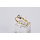 A YELLOW METAL SINGLE STONE DIAMOND RING, designed with a claw set round brilliant cut diamond,